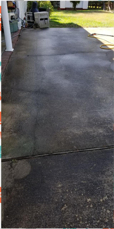 Clean concrete driveway after pressure washing